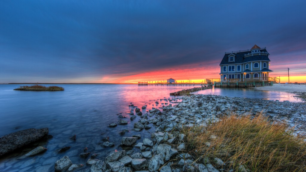 An HDR sunset of Antoinetta's Restaurant on Cedar Run Dock Road in Manahawkin, NJ. While grays and blues set the tone of this seascape, the fire lit sunset in the distance elevates the drama with strong reds and pinks.