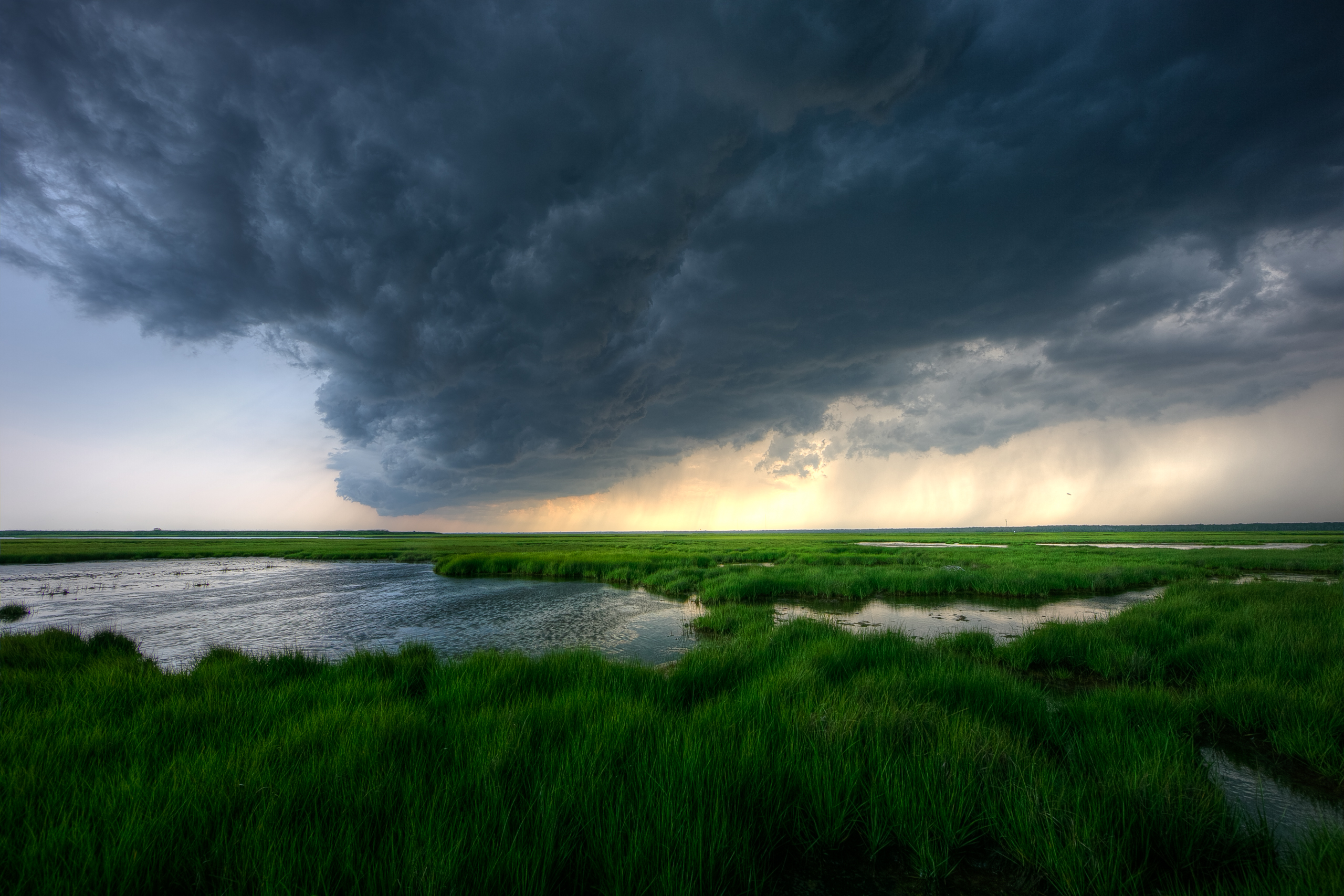 Storm clouds roll in over southern New Jersey marshland