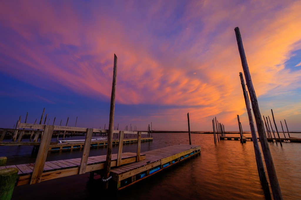 An HDR photograph taken at sunset from Rand's on Great Bay Boulevard featuring an imposing cloud deck backing in off the ocean awash in pinks and purples from the just departed sun.