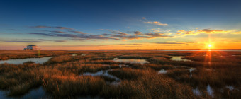 An HDR photograph taken at sunset on Christmas Day overlooking the glowing embers of the south marsh from Cedar Run Dock Road.