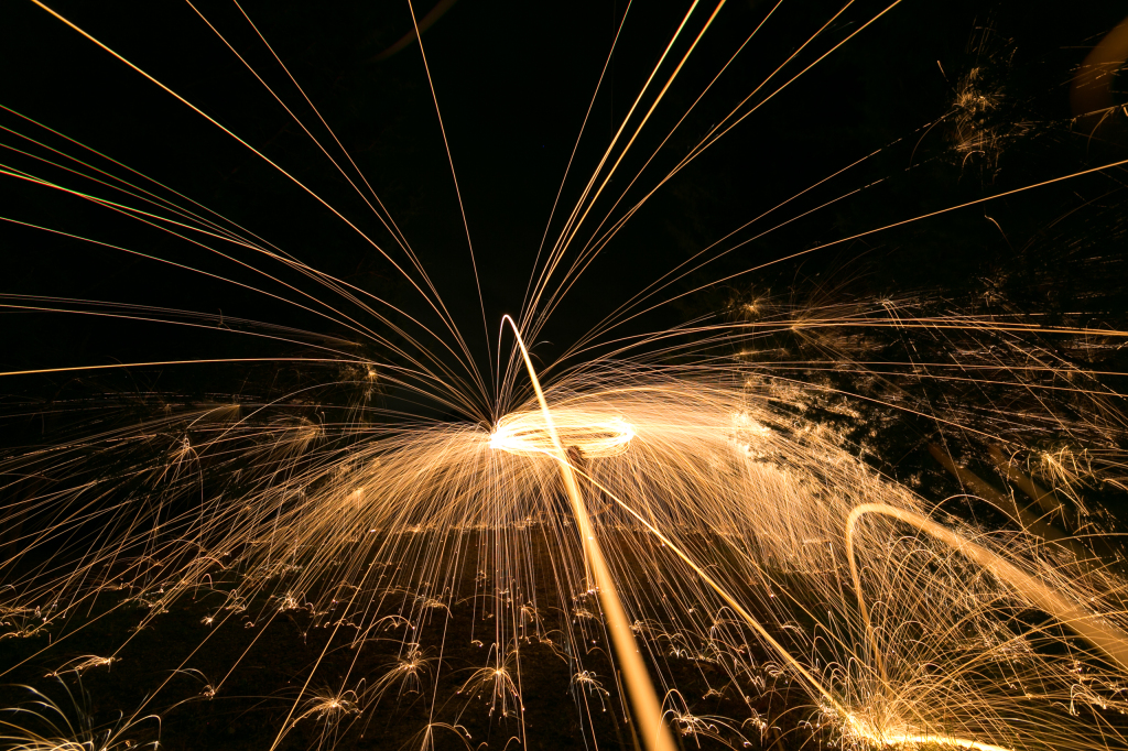 Spinning steel wool overhead to light paint a position reminiscent of a resplendent She-Ra lifting her sword.