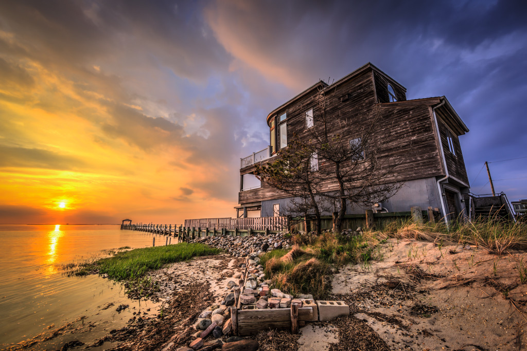 High drama at sunset befalls a lone house sitting along the bayfront of Little Egg Harbor in this HDR sunset photograph