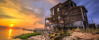 High drama at sunset befalls a lone house sitting along the bayfront of Little Egg Harbor in this HDR sunset photograph