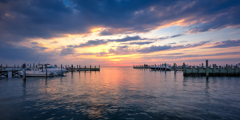 HDR sunset photograph of clouds, water, boats, docks and light made from Beach Haven, LBI. overlooking Little Egg Harbor