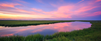 HDR photograph of pastel sky colors at blue hour overlooking a marsh