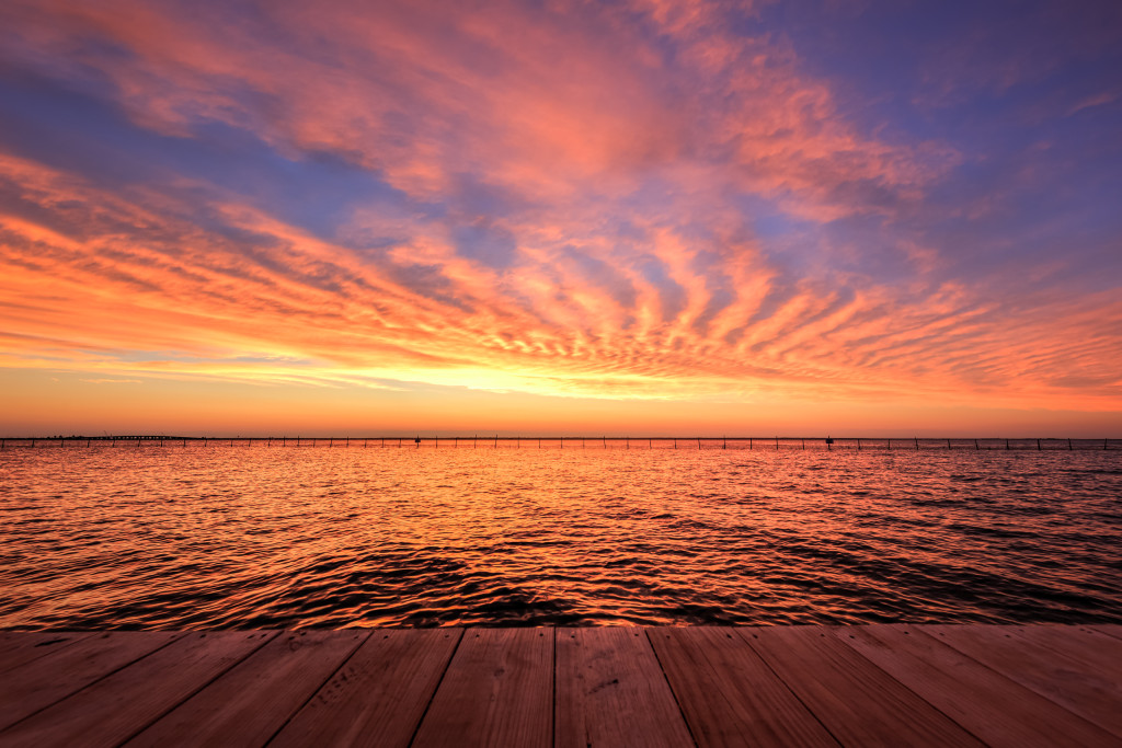 HDR photograph of a fiery sunset over Barnegat Bay as seen from Surf City, NJ