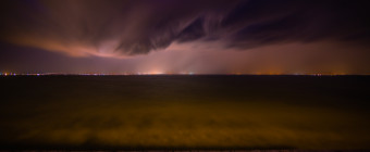 Wide angle long exposure photograph of a demonic shelf cloud over Barnegat Bay