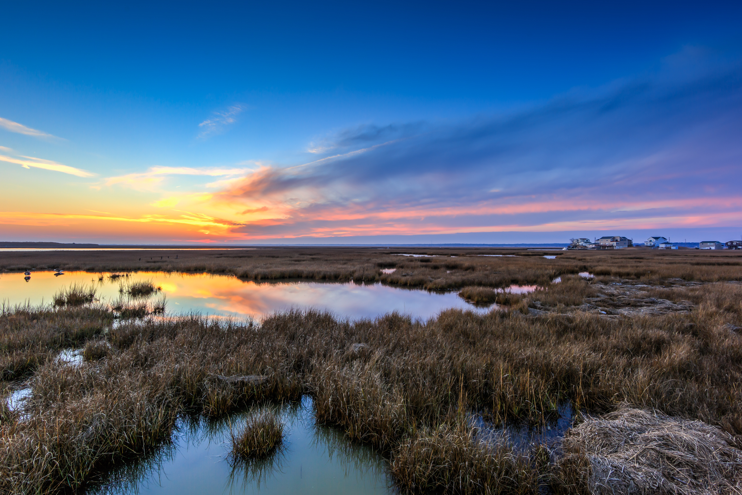 HDR landscape photograph of sunset fading to blue hour over the salt marsh