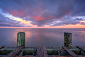Sunset photograph overlooking Barnegat Bay and a decrepit bulkhead