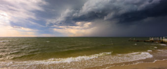 Wide angle photograph of an ominous shelf cloud storming over Barnegat Bay en route to Long Beach Island