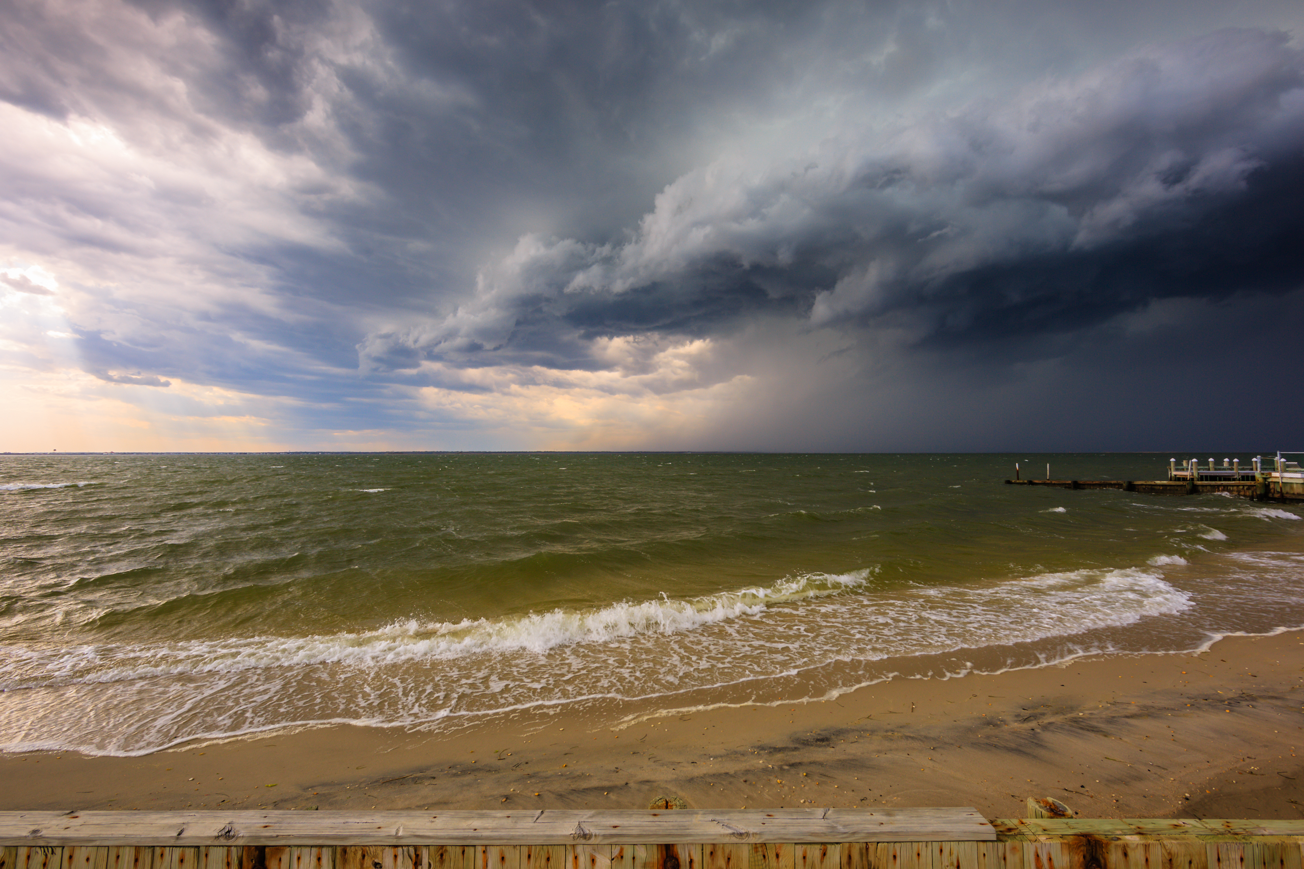 Wide angle photograph of an ominous shelf cloud storming over Barnegat Bay en route to Long Beach Island