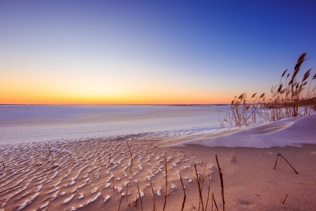 Sunset photo over frozen Barnegat Bay in Harvey Cedars, NJ.