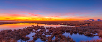 14mm wide angle sunset photo made on Christmas Eve 2019, glowing over Cedar Run Dock Road salt marsh.
