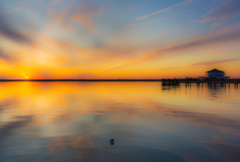 35mm photo capturing a golden sunset lighting the calm water of Little Egg Harbor to mark 2019 winter solstice.