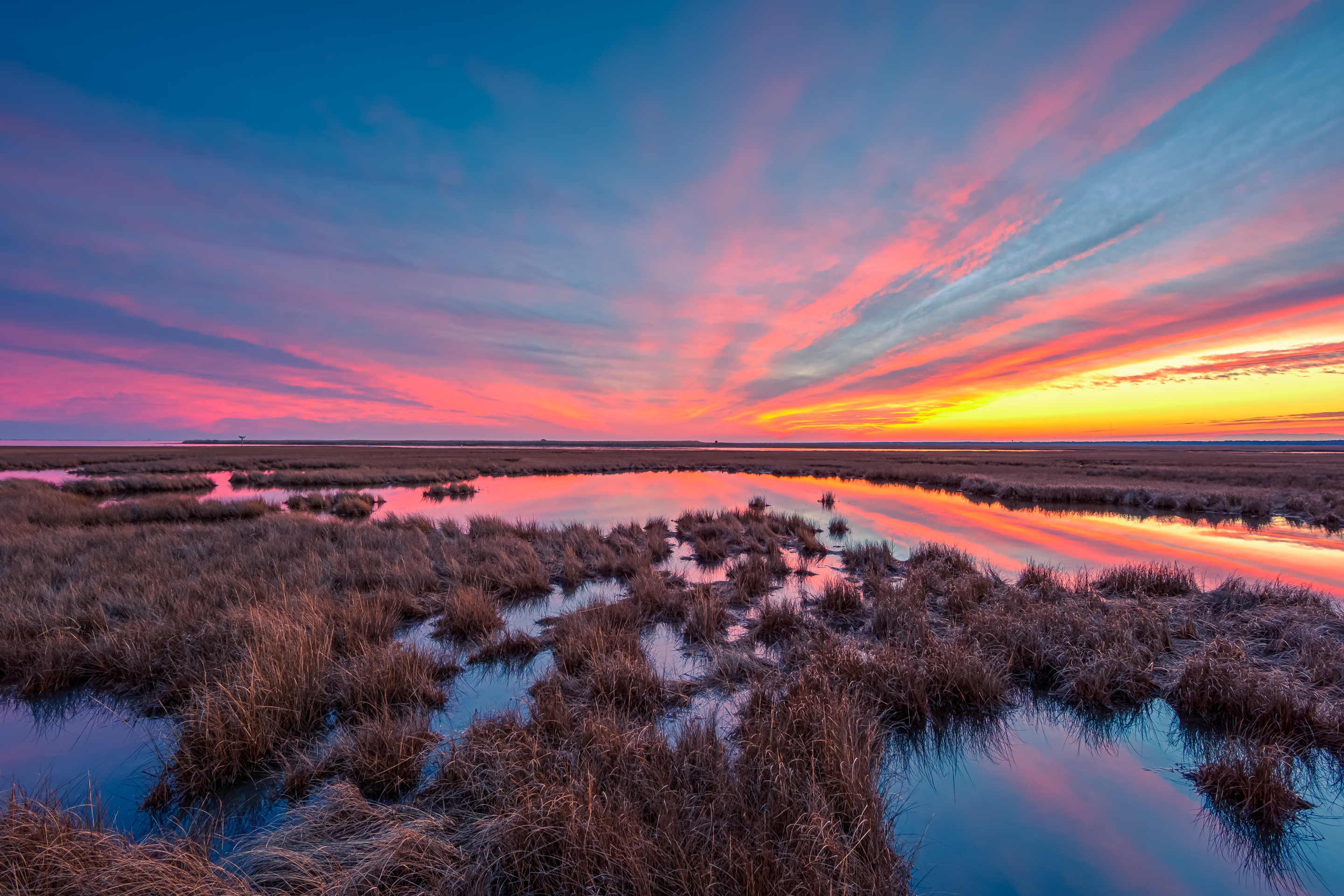 14mm wide angle sunset photo made in winter over the dormant Cedar Run Dock Road salt marsh.