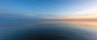 14mm blue hour photo of a calm Little Egg Harbor. Using left to right panning to create a smooth motion blur.