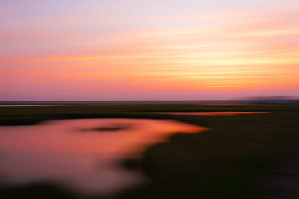 Burning Heart 35mm 3:2 motion blur sunset photo executed with the left to right panning to create the horizontal motion blur flowing across the frame.
