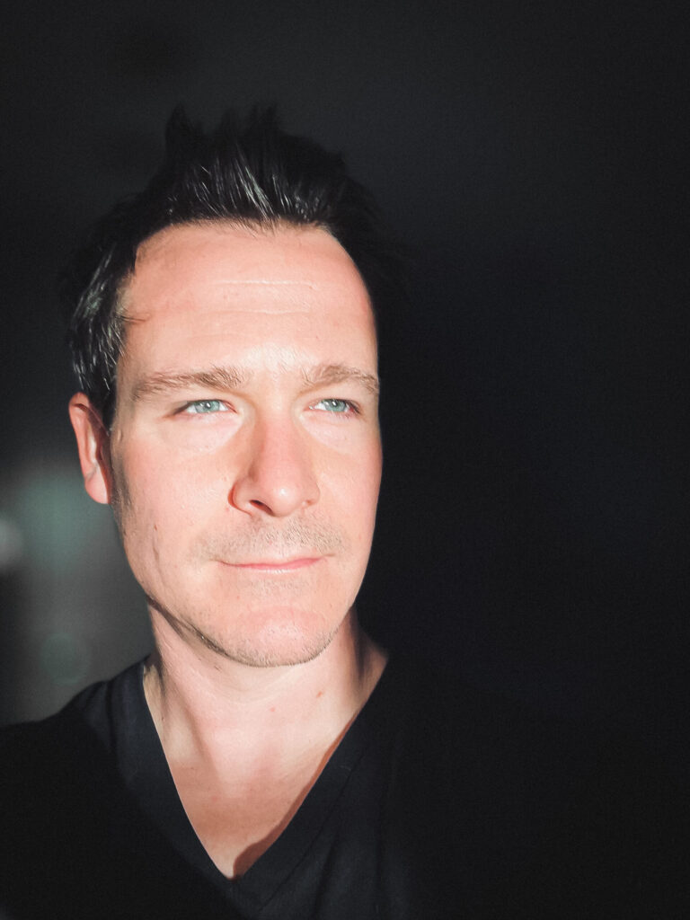 Strong contrast self portrait of photographer Greg Molyneux