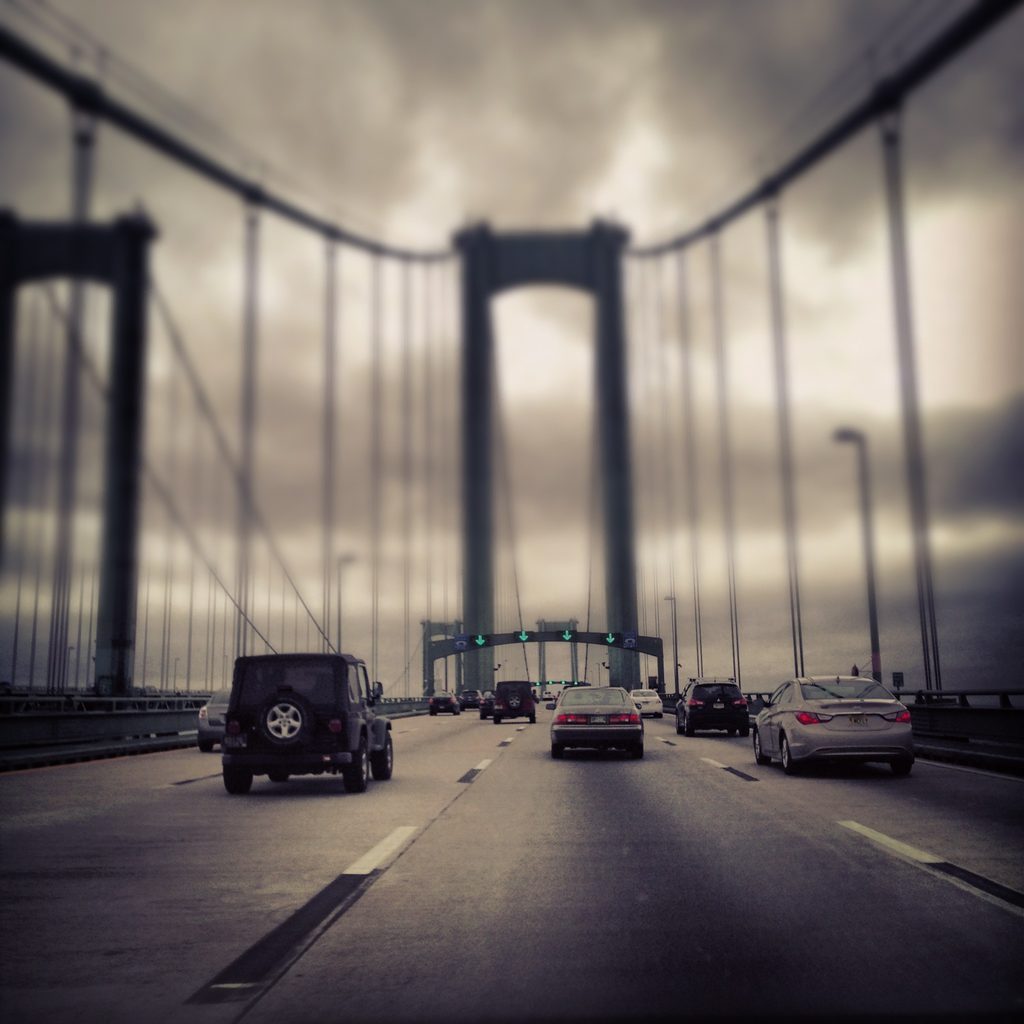 Roadway and bridge structure on the northbound Delaware Memorial Bridge, crossing the Delaware River toward New Jersey.